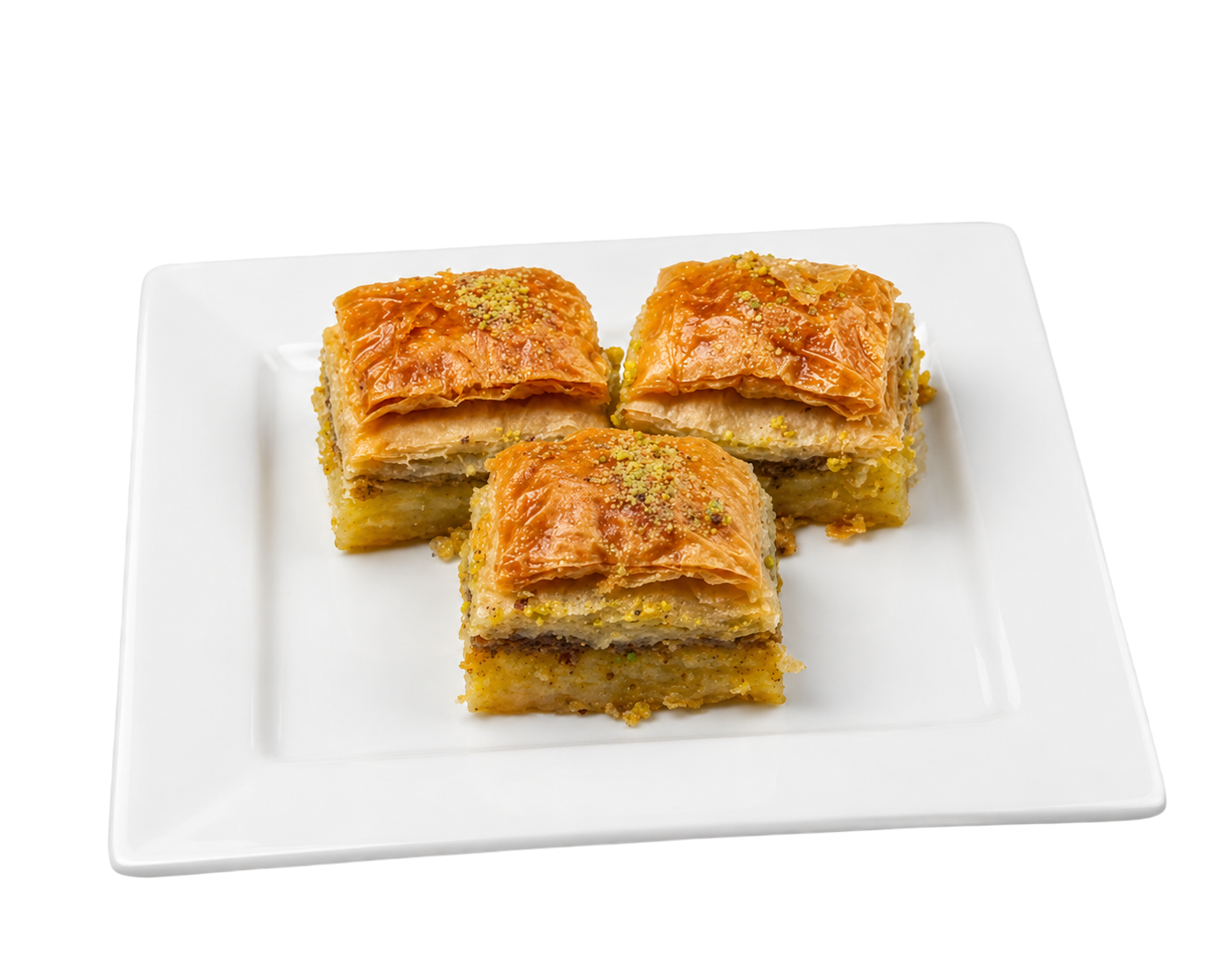 Three square pieces of baklava with golden flaky layers and crushed pistachios on a white plate.