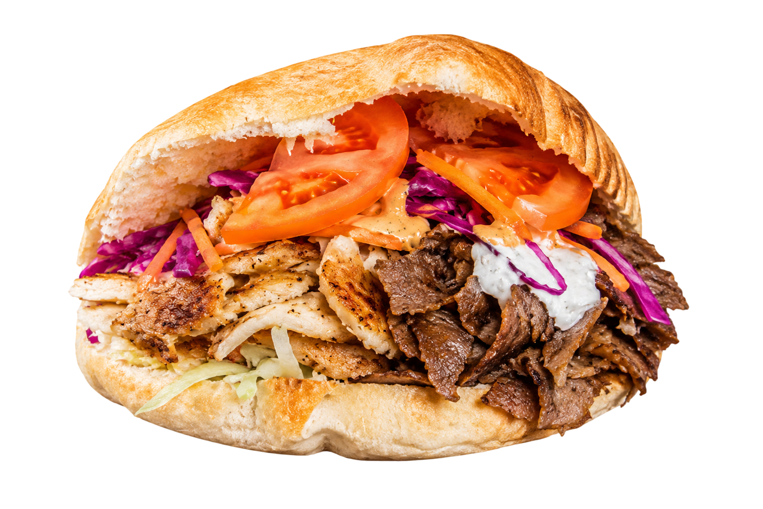 Doner kebab sandwich with sliced grilled meat, tomato, cabbage, carrot, and white sauce in pita bread.